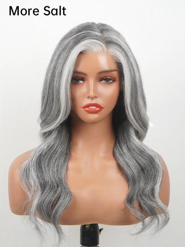 Front view of a long silver grey wavy wig with more salt tone and signature white front streaks, made of 100% human hair, perfect for natural and elegant everyday styling