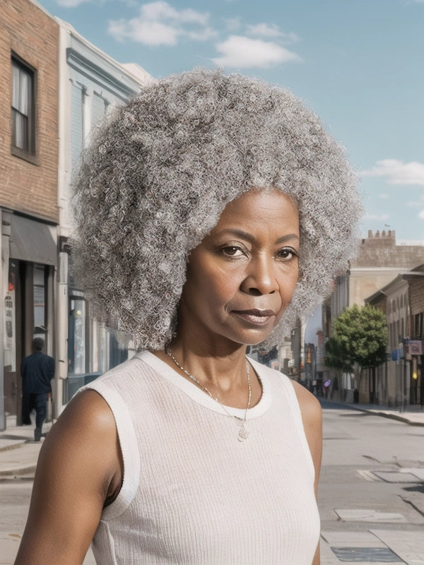 Mature African American woman wearing Luvwin Salt & Pepper Afro Natural Hairstyle Wig, soft natural curls, realistic gray highlights, beginner-friendly human hair wig suitable for women of all ages, stylish and easy-to-wear for work events, parties, or weekend activities