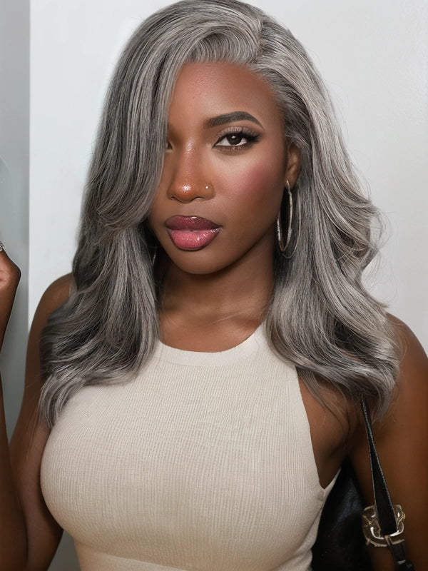 Mature African American woman wearing Luvwin 100% human hair Salt & Pepper Gray Glueless Layered Wave Wig, natural look, comfortable fit, easy-to-style wig for Black women seeking elegant gray hairstyles