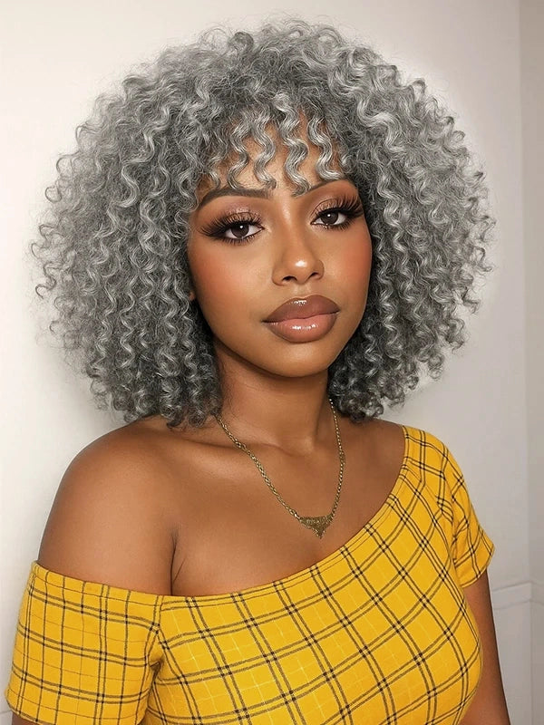 African American woman wearing Luvwin Salt And Pepper Defined Curls Wig with Bangs, soft natural curls, realistic gray highlights, glueless lace wig, 100% human hair, easy-to-style everyday wig for Black women