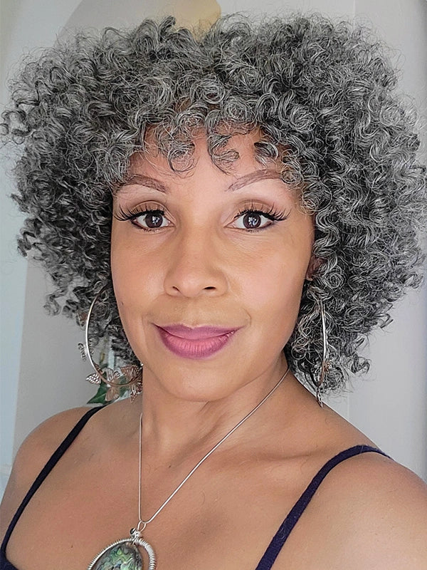Middle-aged woman with Luvwin Salt and Pepper Ringlet Curls Wig, natural salt and pepper hair, casual chic look, ideal for brunch, shopping, or casual outings.