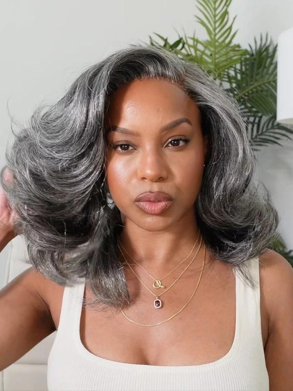 Luvwin Salt & Pepper Layered Blowout Wave Gray Wig on a Black woman, showcasing a natural, voluminous blowout wave style perfect for everyday wear. This salt and pepper gray wig features layered cuts for a realistic, stylish look ideal for African American women seeking a low-maintenance, ready-to-wear hair solution.