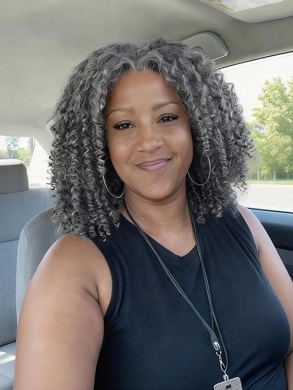 Black woman wearing natural salt and pepper curly gray bob wig with soft realistic curls, everyday casual look hairstyle for mature and confident women.