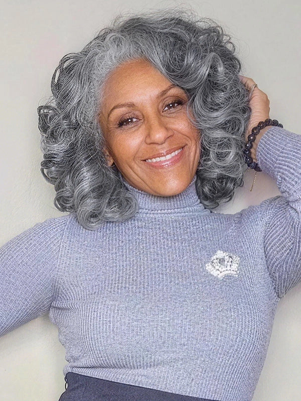 Realistic silver gray curly wig for older women, soft layered salt and pepper human hair wig for everyday wear.