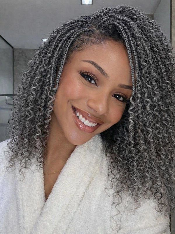 Salt and pepper boho braided curly wig on model showing natural gray curls and realistic everyday look