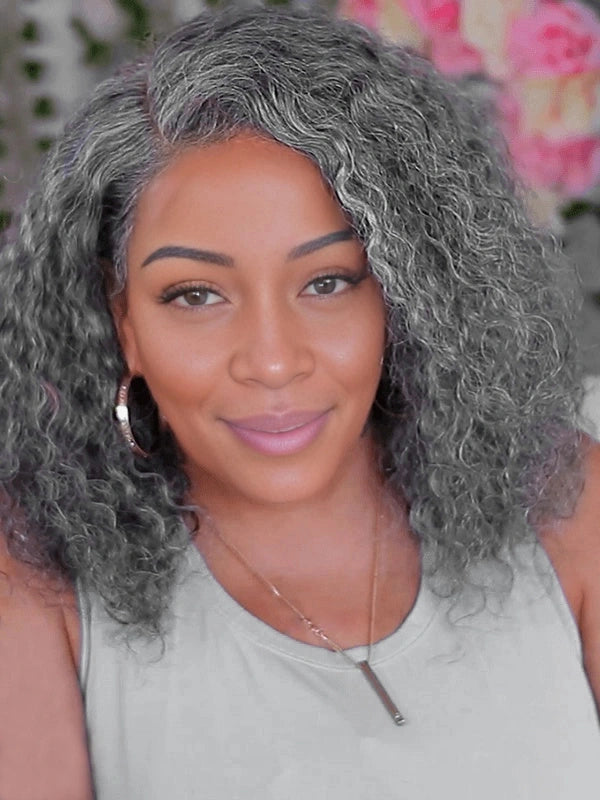 Beautiful middle-aged woman wearing a 5x5 deep curly salt and pepper gray lace bob wig, natural daily style for elegant office look.
