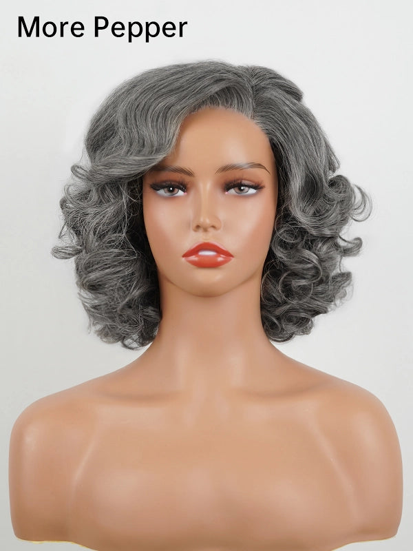 Front view of the Salt And Pepper Steel Grey Retro Waves Bob Wig in the 'More Pepper' color option. This chic bob wig features voluminous, soft curls and a mix of gray and silver tones, offering a stylish retro wave look perfect for a sophisticated appearance.