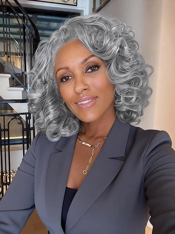 Classy salt and pepper kinky curly gray wig on mature woman, natural looking glueless human hair wig for professional style.