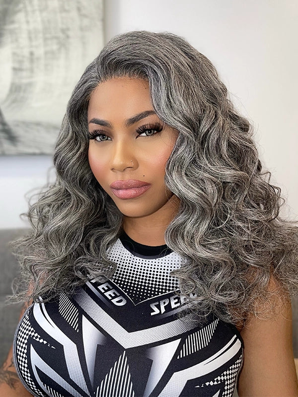 African American woman wearing Luvwin Salt & Pepper Loose Wavy Kinky Hair Wig, gray color, soft natural waves, glueless 5x5 closure lace, 100% human hair, beginner-friendly, stylish and easy-to-style wig for Black women
