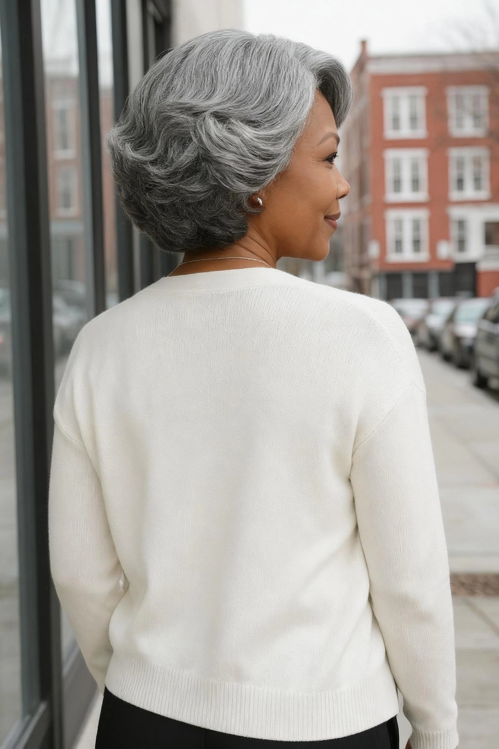 Black woman wearing Luvwin 5x5 Salt & Pepper Gray Color Retro Elegant Wave Wig, soft natural waves, realistic gray highlights, pre-cut lace, easy-to-style human hair wig suitable for work, weekend, or casual occasions