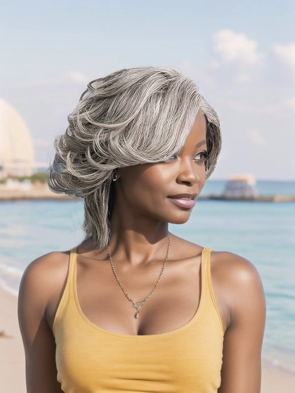 African American woman wearing Luvwin Silver Gray Custom Layered Cut Side Part Hair in Salt & Pepper, soft layered waves, realistic gray highlights, 100% human hair, beginner-friendly wig suitable for mature women and women of all ages, ideal for brunches, social events, or casual outings
