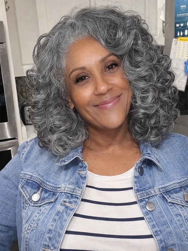 Salt and pepper kinky curly gray wig on older woman, natural looking glueless human hair wig for everyday wear.
