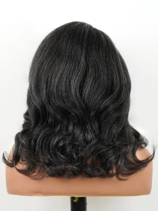 Back view of salt and pepper kinky wave human hair wig showing natural density and soft wavy texture.